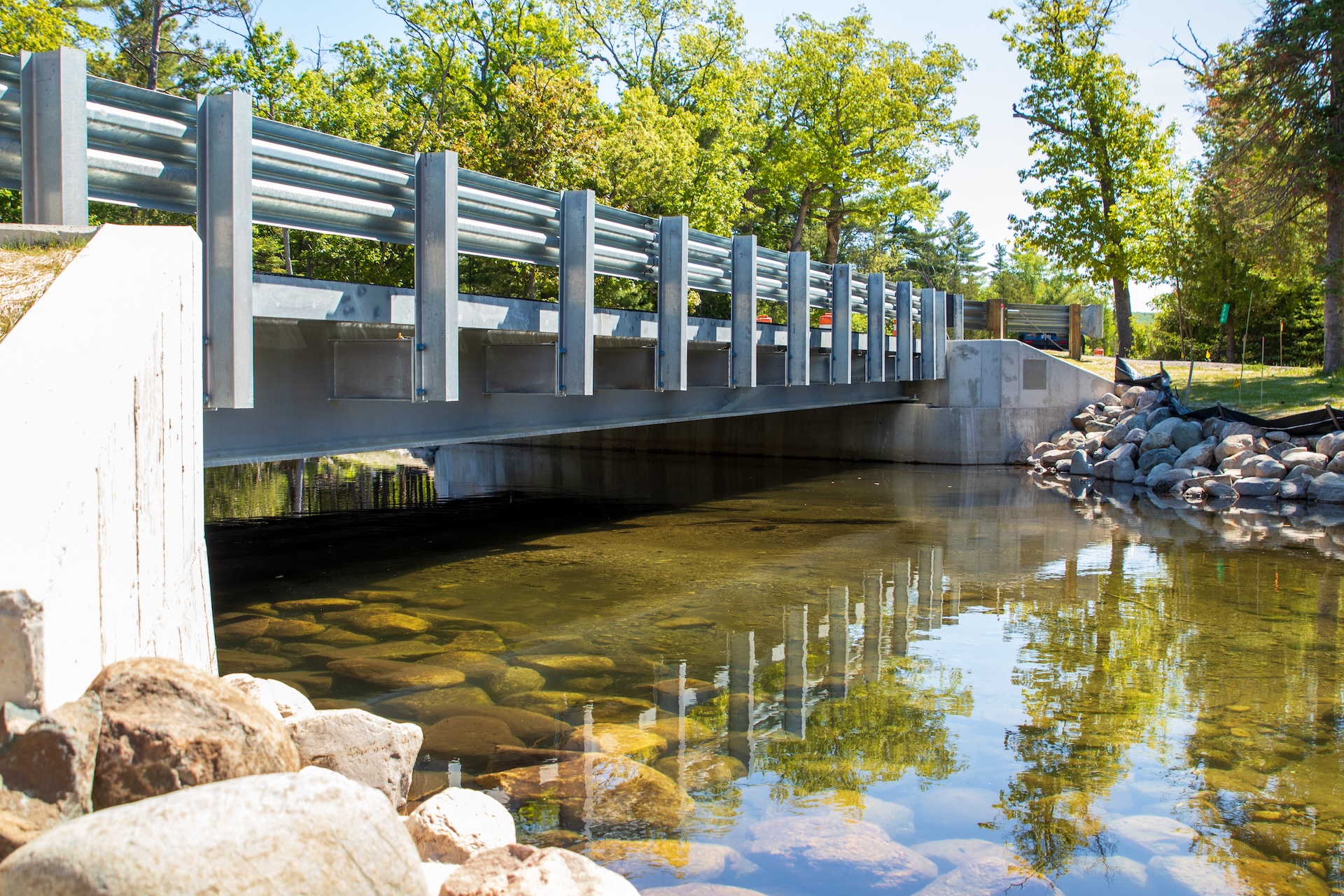 Site #1 After A fully spanning bridge replaced a small undersized culvert, improving stream connectivity and aquatic passage.